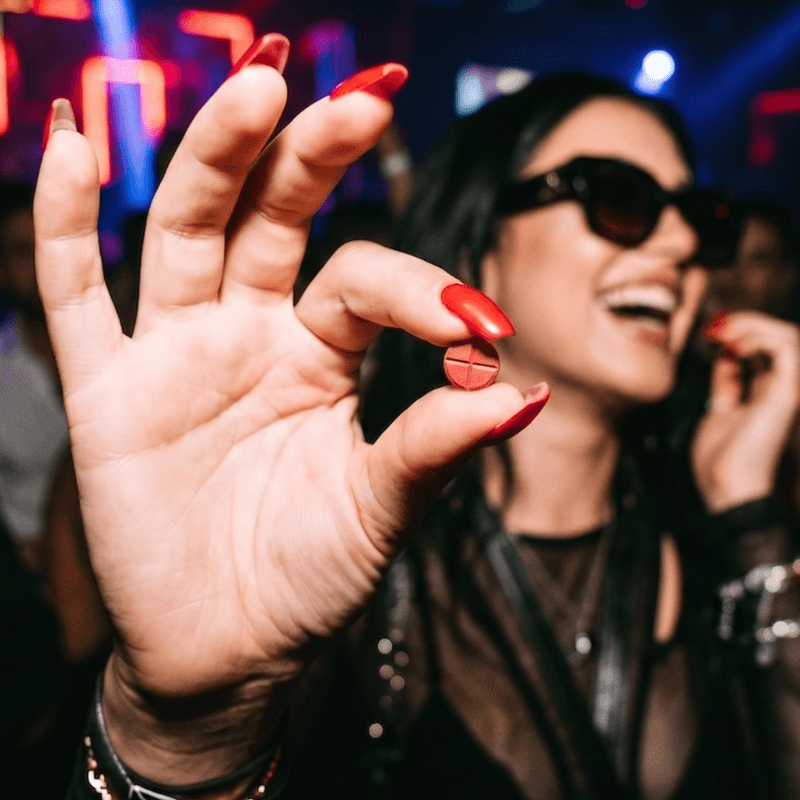 Pop Roxy Akuammine Extract chewable tab held up on a night out